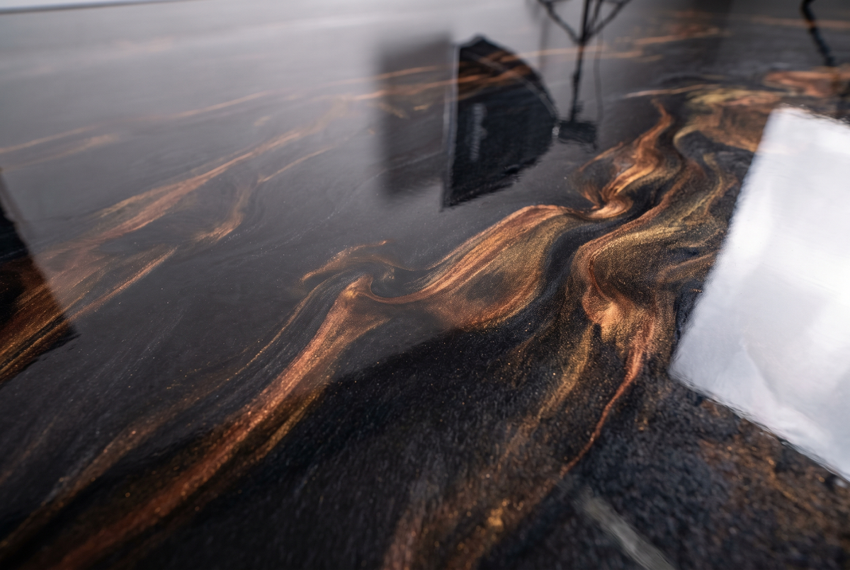 Glossy marbled metallic epoxy floor finish, close up